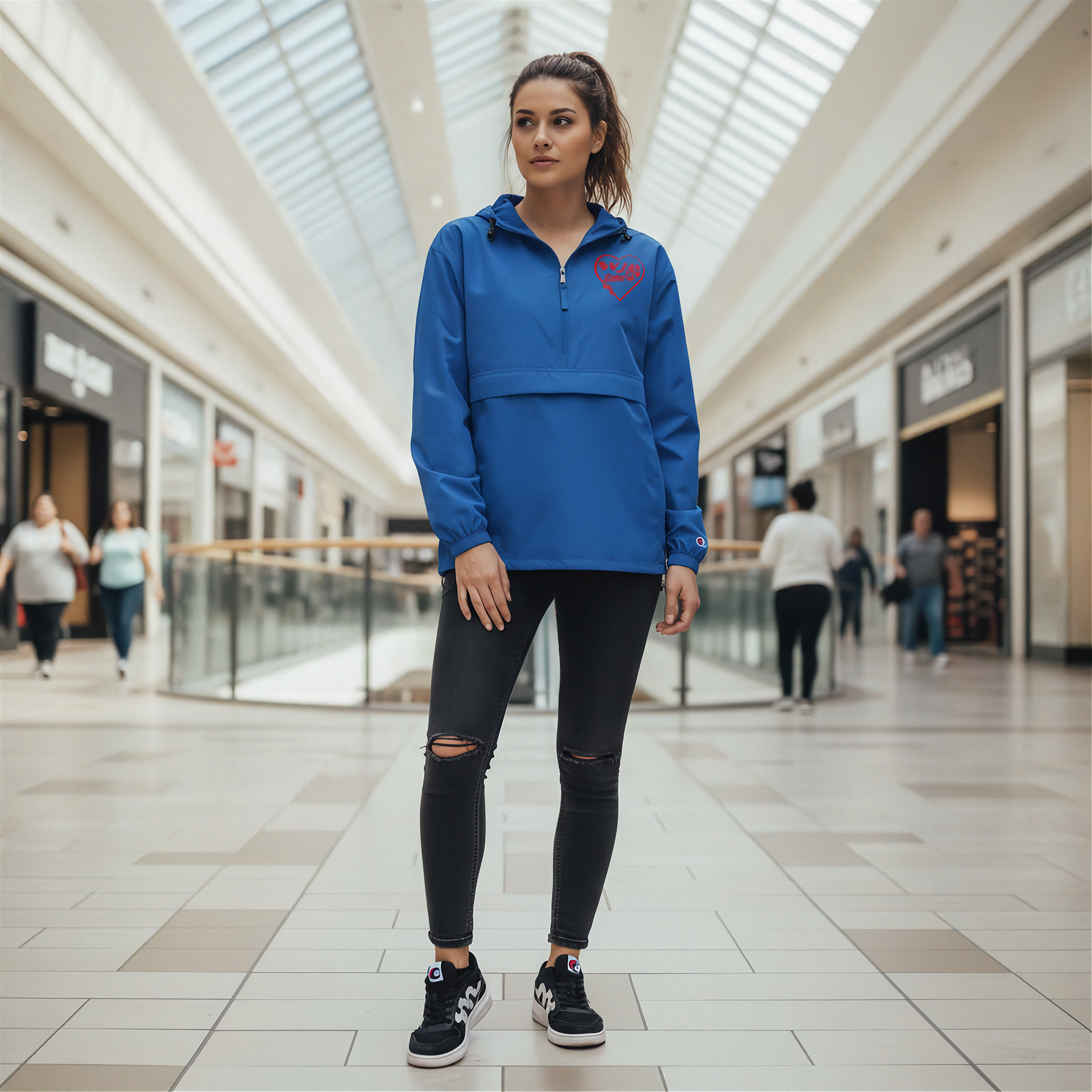 Woman wearing a blue jacket with a red racing daughter heart design in a shopping mall