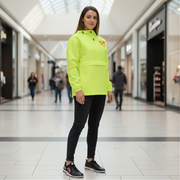Woman wearing a bright yellow raincoat in a shopping mall