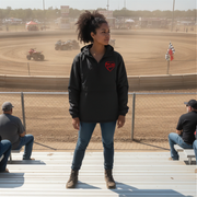 Woman standing on a track with race cars with a red racing daughter heart design in the background