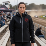 Woman wearing a black jacket with a red racing daughter heart design at a race track.