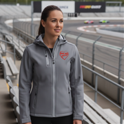 Woman wearing a gray jacket with a red racing daughter heart design at a race track