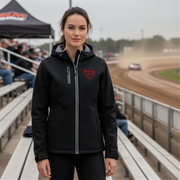 Woman wearing a black jacket with a red racing daughter heart design at a race track.