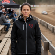 Woman wearing a black jacket with a red racing daughter heart design at a race track.
