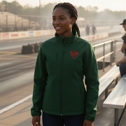 Woman wearing a green jacket with a red racing daughter heart design on a race track