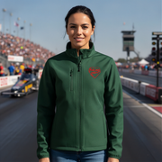 Woman wearing a green jacket with a red racing daughter heart design at a race track.