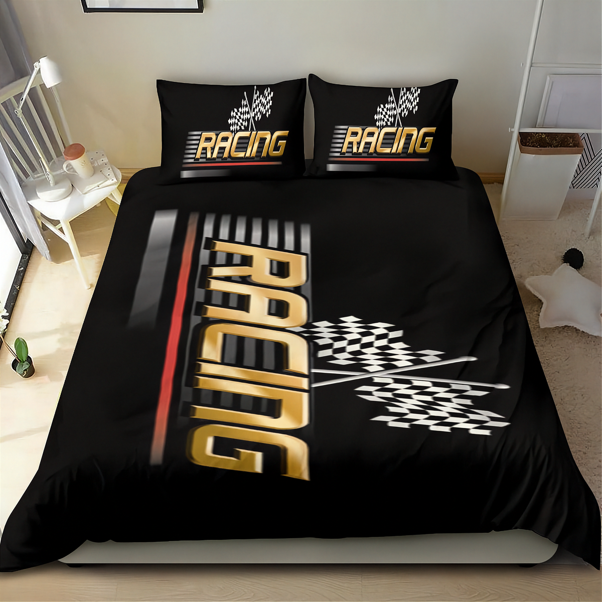 A racing-themed bedding set featuring a black duvet cover and two matching pillowcases with a bold gold, white, and gray 'RACING' graphic and checkered flag motif, shown on a bed in a bedroom setting.