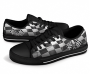 Black and white checkered sneakers with racing flag design on a white background