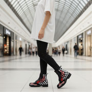Woman wearing black checkered boots in a mall setting