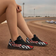 Woman wearing black and red checkered shoes with 'Racing Mom' text on a race track.