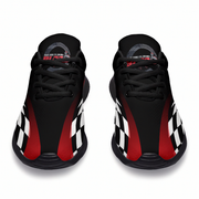 Black sneakers with red and white checkered pattern on a white background