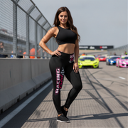 Woman wearing  racing girl leggings standing on a race track with racing cars in the background