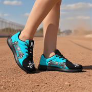 Black and blue sneakers with checkered pattern on a dirt track