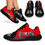 woman wearing a racing girl sneakers in red and black with a white background