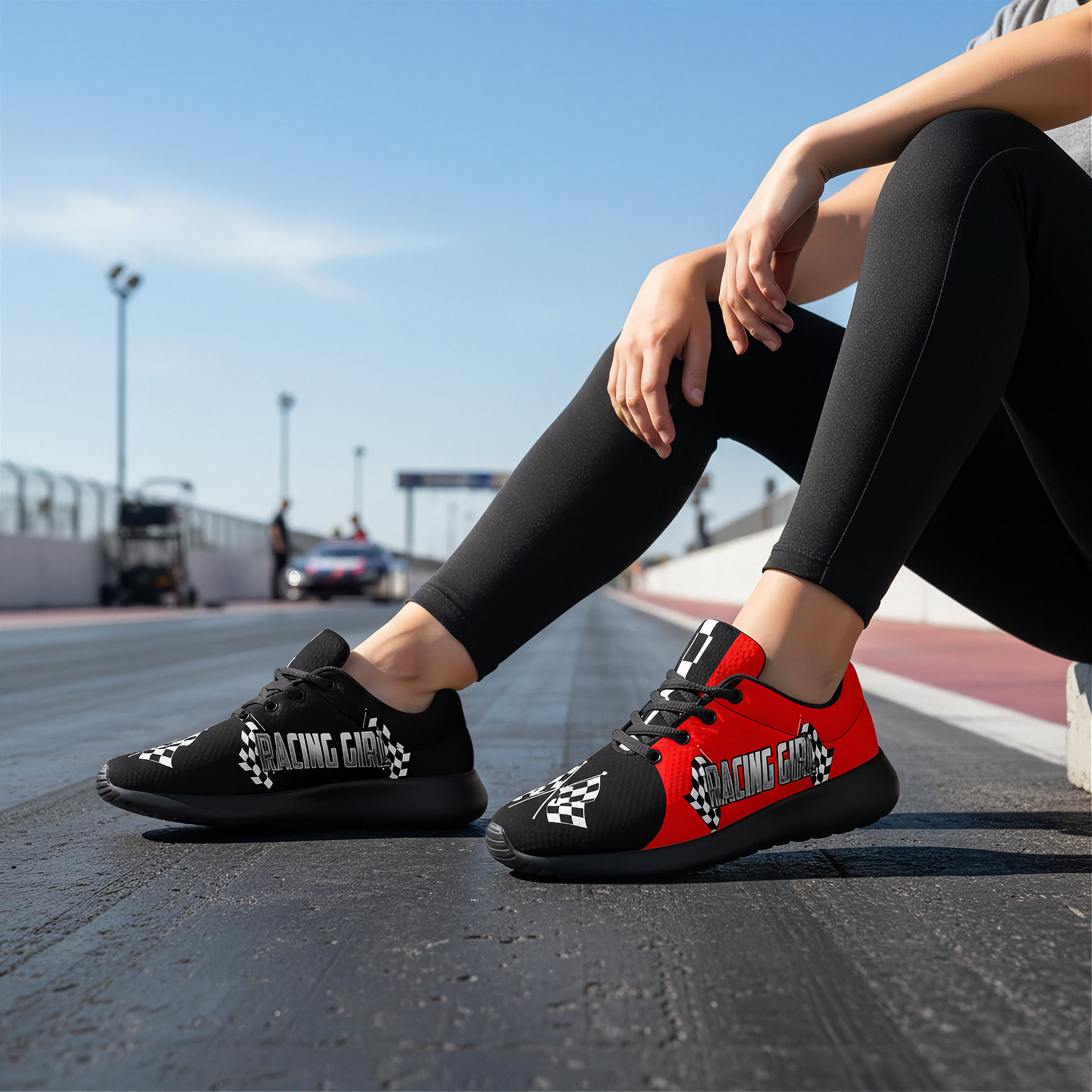 woman at a drag race track wearing a racing girl sneakers in red and black