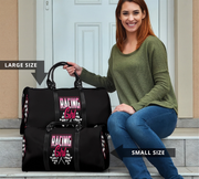 Woman holding two black bags with 'Racing Girl' text, sitting on steps.