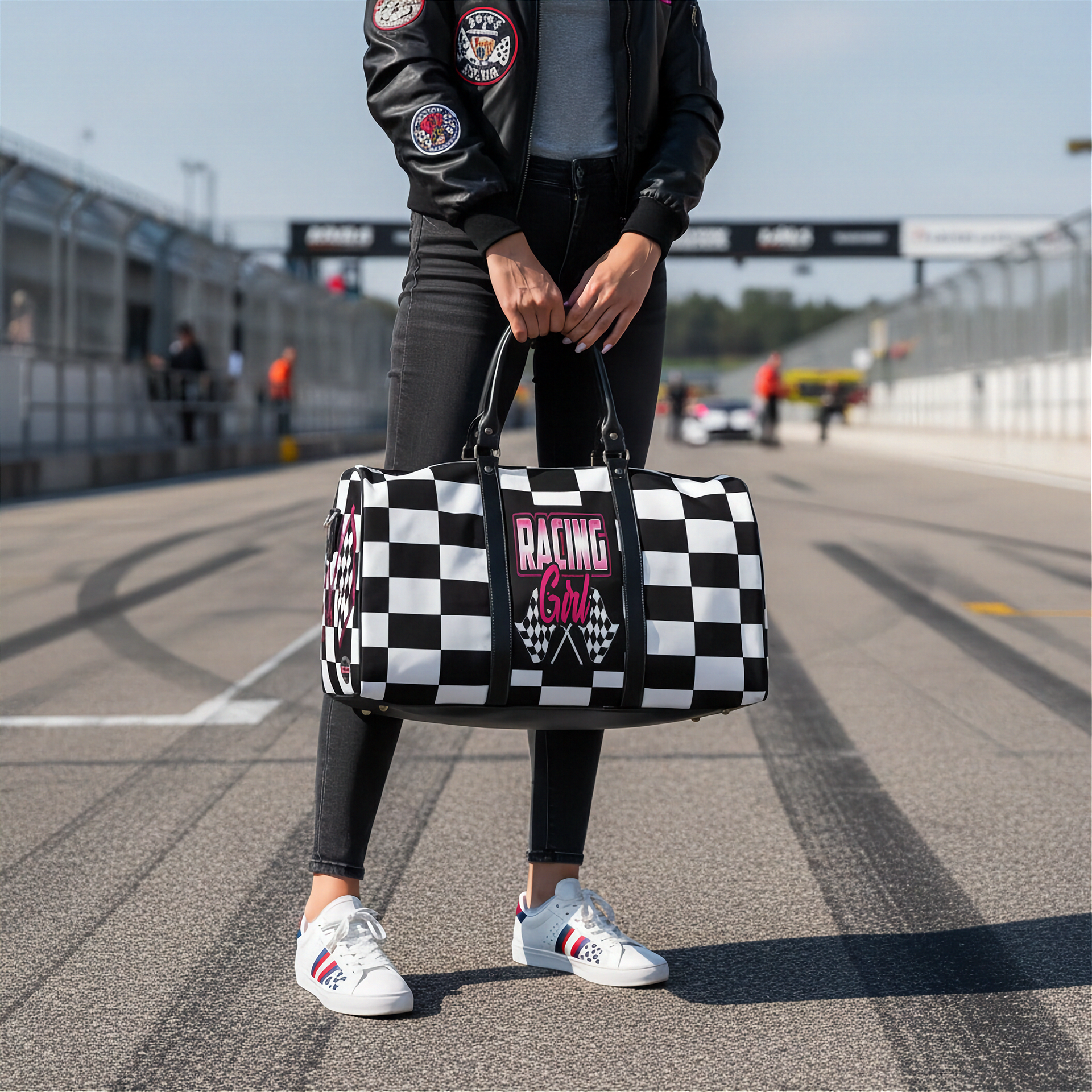 Woman holding a travel bag with a pink racing girl and checkered flag design, customizable text.