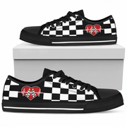 Black and white checkered sneakers with a red heart design on a white background
