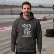 Man wearing a hoodie with 'Racing Husband' text on a race track background