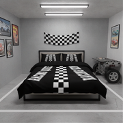 A racing-themed bedding set displayed on a bed in a garage-style bedroom mockup. The set includes a black duvet cover and matching pillowcases decorated with white checkered squares and 'RACING' text, with a matching black-and-white checkered banner hanging on the wall above the headboard.