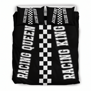 A racing-themed bedding set featuring a black duvet cover and two matching pillowcases with bold white text reading 'RACING QUEEN' and 'RACING KING' alongside a central black-and-white checkered stripe.