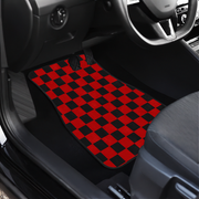 Interior of a car showing a checkered black and red car mats on the front