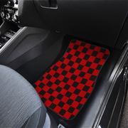 checkered black and red car mats placed on the interior of a car