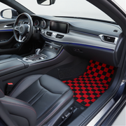 checkered red and black car mats placed on the interior of a car