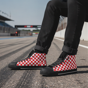 Red and white checkered shoes worn on a race track