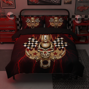 A bed dressed in a black racing-themed bedding set with a large metallic gold skull, crossed pistons, checkered flags, and red lightning effects. The room includes red toy cars, a red tool chest, and racing posters on the walls.