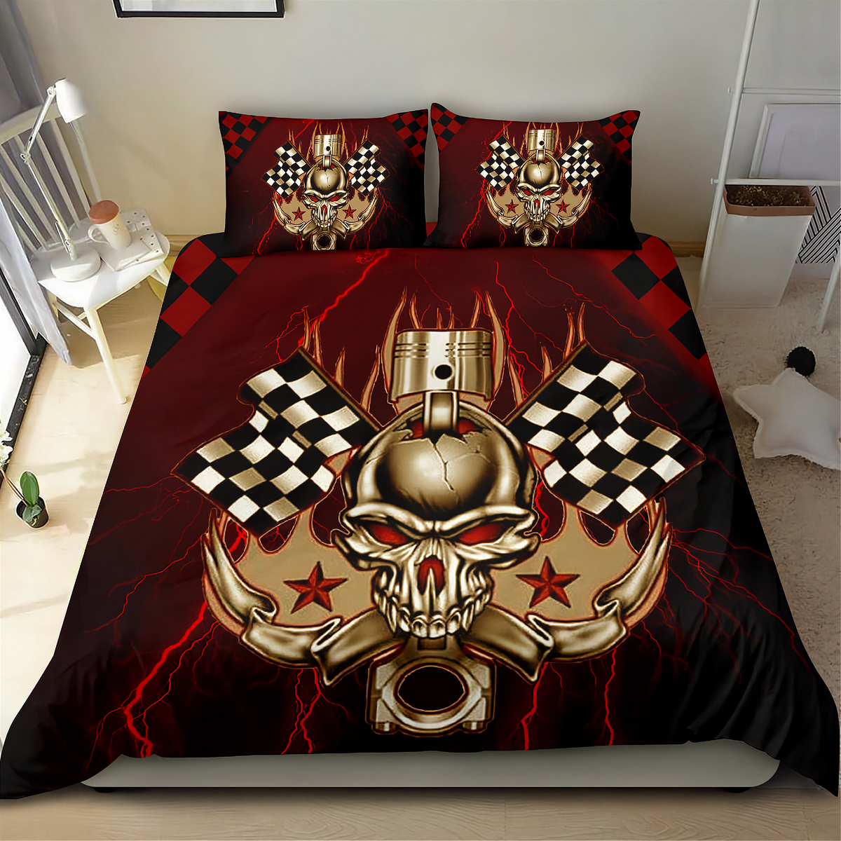 A bed dressed with a bold graphic bedding set featuring a large metallic skull and piston design with checkered flags and red lightning on a black background, shown in a bedroom setting.