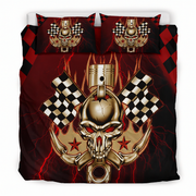 A bedding set featuring a duvet cover and two matching pillowcases with a bold racing-themed graphic design. The design includes a metallic gold skull and piston, red lightning bolts, checkered flags, and red stars on a dark red and black background.