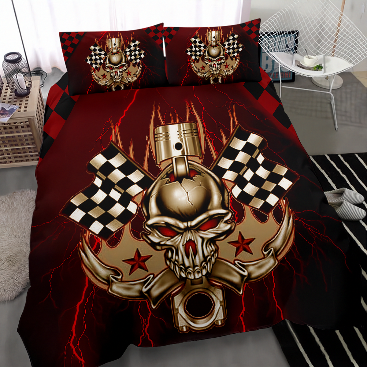 A bedding set featuring a bold graphic design of a metallic gold skull with a piston head, red lightning bolts, checkered flags, and stars on a black and red background. The set includes a duvet cover and two matching pillowcases, shown in a modern bedroom setting.