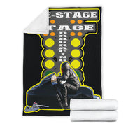 Snowmobile photo blanket displayed flat with a corner turned back to show white microfleece backing, beside folded blankets.