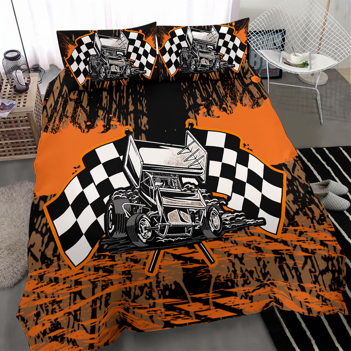 A racing-themed bedding set featuring a duvet cover and two pillowcases with a black and orange track flag graphic and a detailed race car illustration, displayed on a bed in a modern bedroom setting.