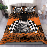 A racing-themed bedding set featuring a duvet cover and two pillowcases with a graphic of a sprint car between two black-and-white checkered flags, set on a bed in a styled bedroom.