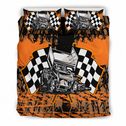 A racing-themed bedding set featuring a duvet cover and two pillowcases with a graphic print of a sprint car between two black-and-white checkered flags on an orange and black splattered background.