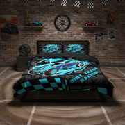 A bed dressed in a black and turquoise dirt track racing themed comforter set, shown in a themed bedroom with a brick wall, racing posters, and a dirt floor.
