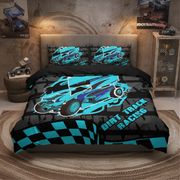 A racing-themed bedding set displayed on a bed in a styled bedroom. The set includes a duvet cover and two pillowcases featuring a graphic of a blue and black dirt track racing car with the words 'DIRT TRACK RACING' and a checkered pattern at the bottom.
