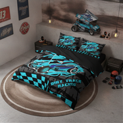 A racing-themed bedding set with a duvet cover and two pillowcases featuring a blue, black, and gray dirt track race car design with checkered patterns. The set is styled in a modern, industrial-themed bedroom with a concrete floor, a round rug, and a racing car model on the headboard.