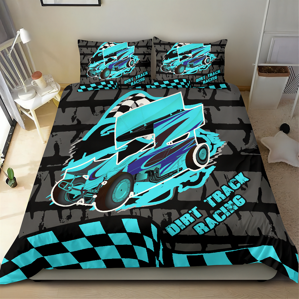 A bed dressed in a dirt track racing themed bedding set, featuring a large turquoise and purple race car graphic on a black and gray brick-patterned background, with matching pillowcases and a checkered border.