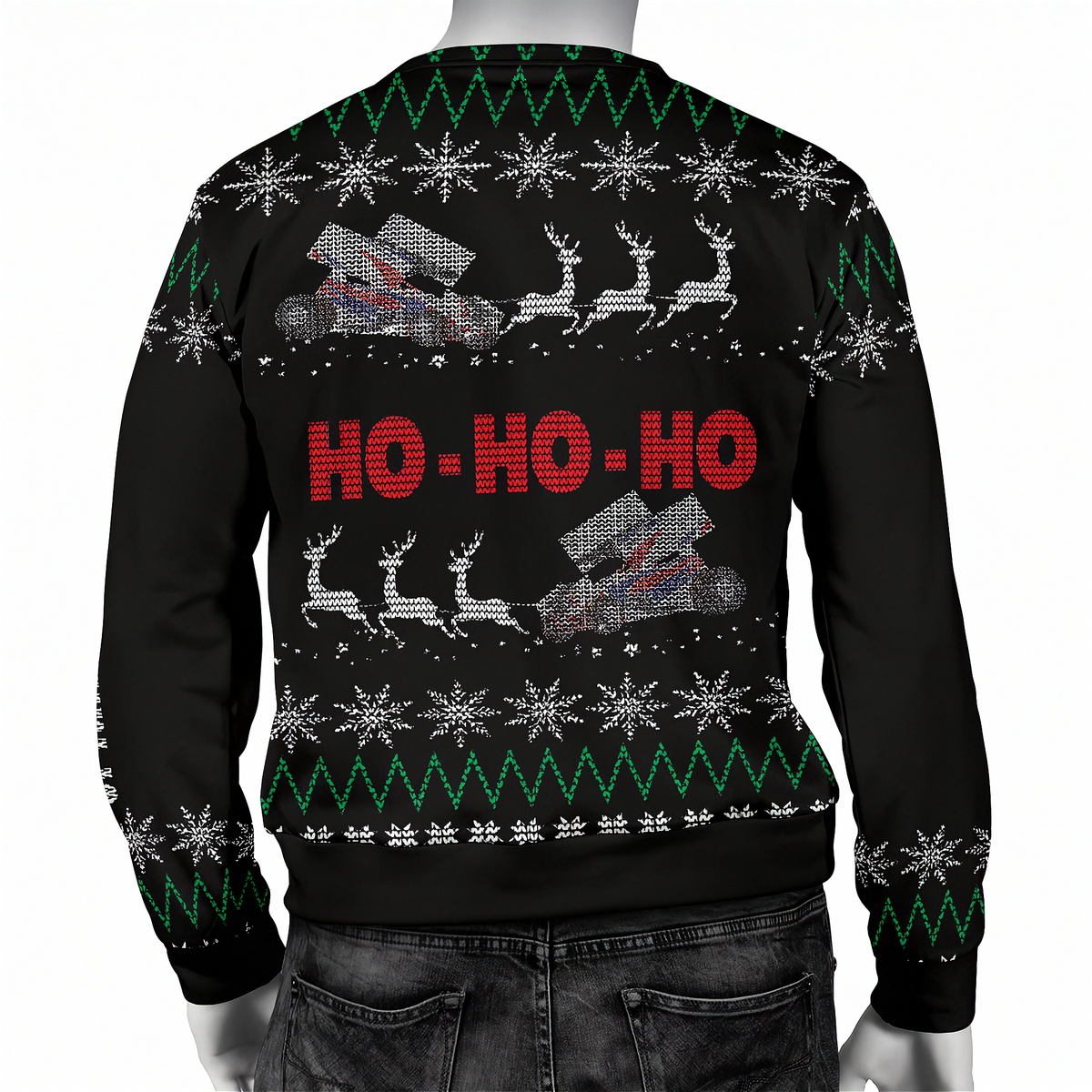 A black long-sleeve Christmas sweater shown from the back on a mannequin, featuring red 'HO-HO-HO' text, white snowflakes, green zigzag patterns, and gray reindeer sleigh graphics.