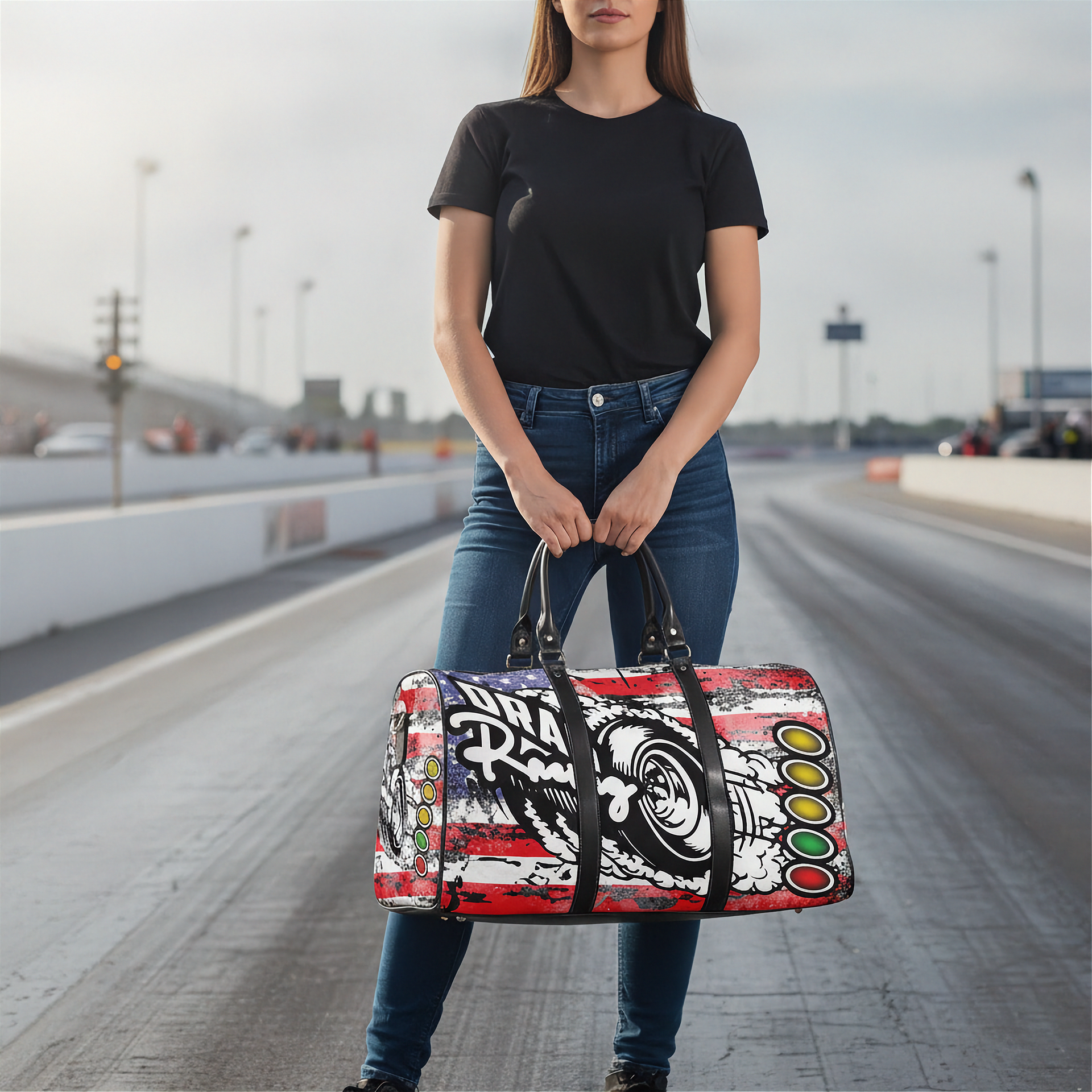 Woman holding a usa drag racing duffel bag on a road