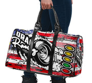 USA Drag Racing Travel Bag featuring waterproof material, patriotic motorsports graphics, padded handles, and an adjustable shoulder strap for track day organization.