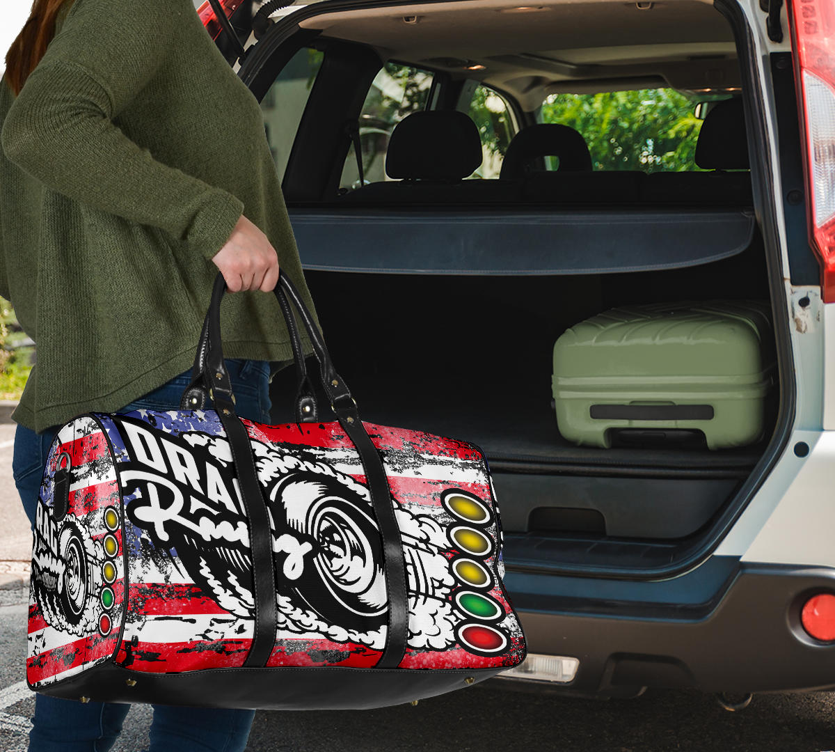 USA Drag Racing Travel Bag featuring waterproof material, patriotic motorsports graphics, padded handles, and an adjustable shoulder strap for track day organization.