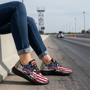 woman wearing American flag drag racing shoes on a race track.
