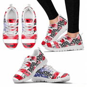 A set of athletic sneakers shown from multiple angles on a white background, with one pair worn on a lower leg. The shoes have a bold abstract pattern in red, white, black, and some blue, with white laces and white soles.