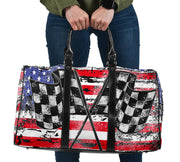 USA Racing Travel Bag featuring waterproof material, a custom patriotic motorsports design, padded handles, and an adjustable shoulder strap for track day gear.