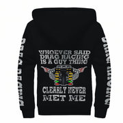 Black pullover hoodie shown from the back with a large drag racing graphic and text. The design features a drag racing engine illustration with a checkered flag and the phrases 'WHOEVER SAID DRAG RACING IS A GUY THING' and 'CLEARLY NEVER MET ME'.