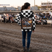 Woman at a dirt track showing the personalized non-wing sprint car artwork on her checkered sherpa jacket.