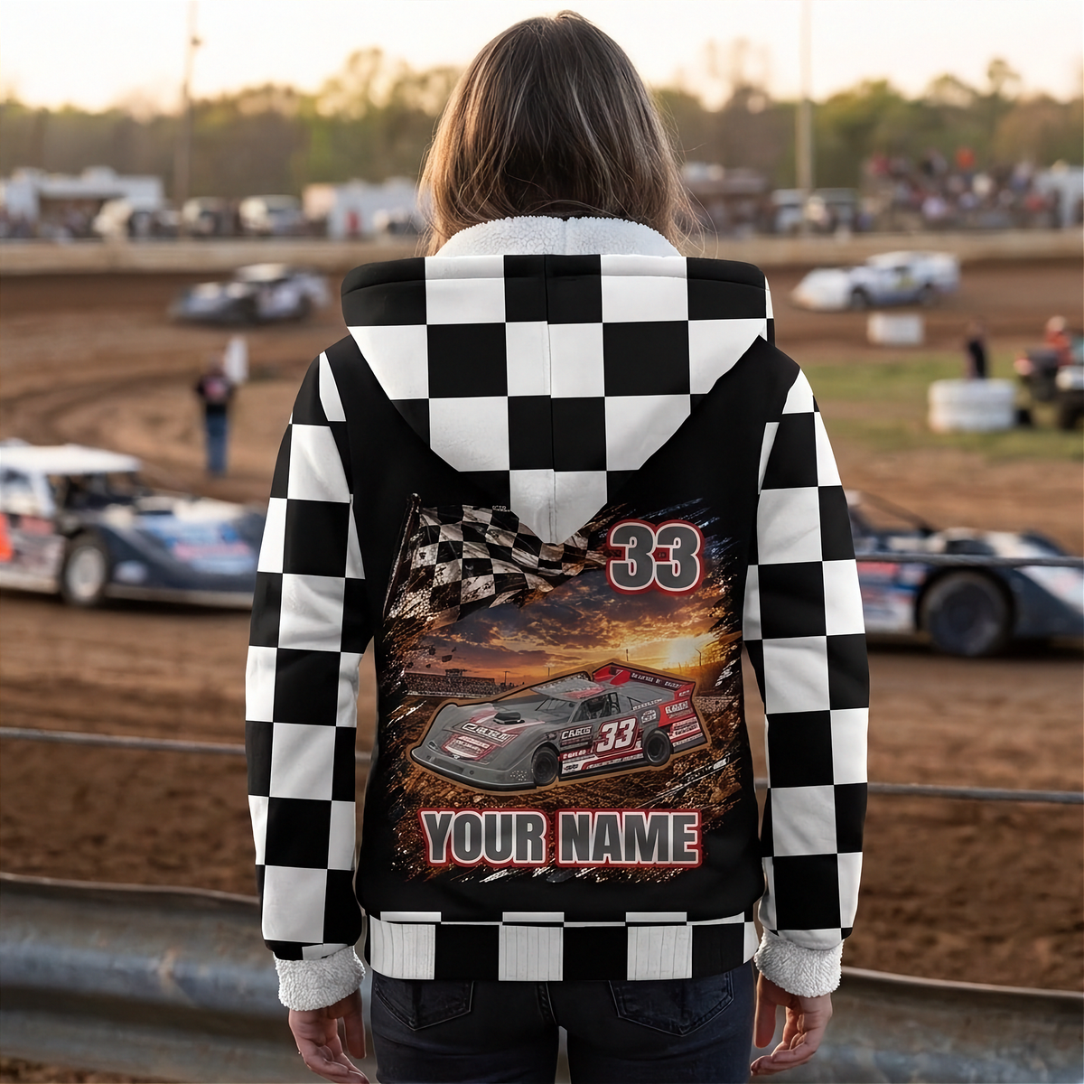 Woman watching late model racing at sunset, showing the personalized back design and checkered sleeves and hood.
